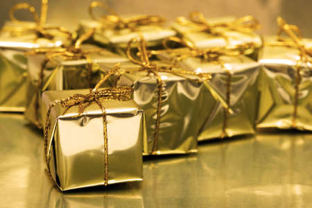 Stack of golden gift boxes の写真素材