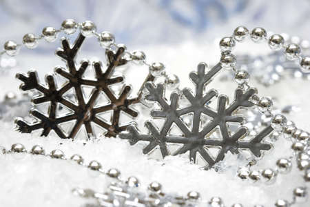 beautiful snowflake on snow background の写真素材