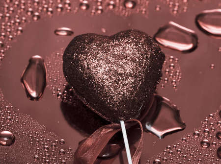 Holidays card, heart on background with water droplets の写真素材