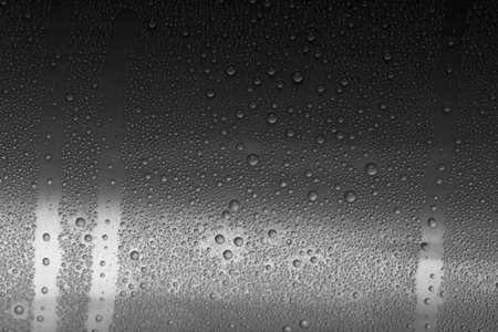 black water drops for background の写真素材