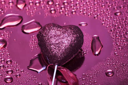 Holidays card, heart on background with water droplets の写真素材