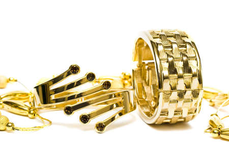 golden bracelets with beads isolated on white background の写真素材