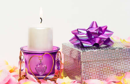 violet candle with heart and gift box の写真素材