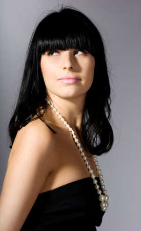 beautiful woman with white beads の写真素材