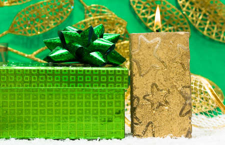 festive candle with green present の写真素材