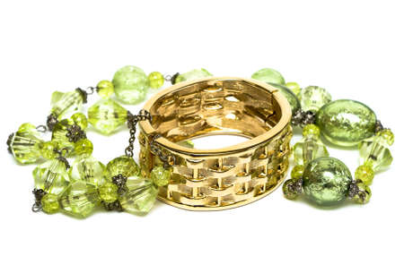 golden bracelet with beads isolated on white background の写真素材