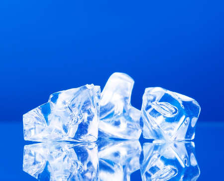 close-up of ice cubes on blue の写真素材