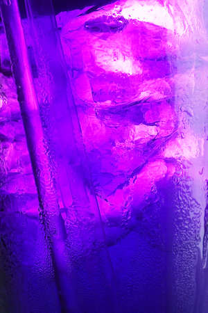 glass with ice and tube for background の写真素材