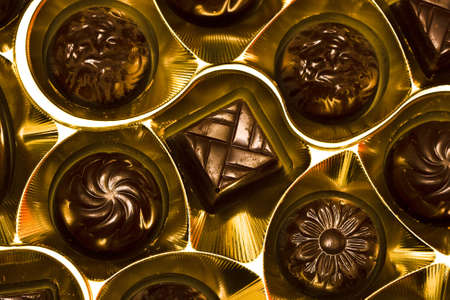 chocolate candy in golden box の写真素材