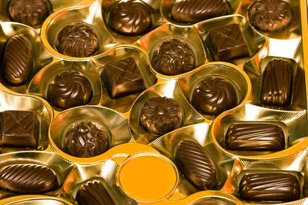 chocolate candy in golden box の写真素材