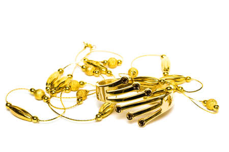 golden bracelet with beads isolated on white background の写真素材