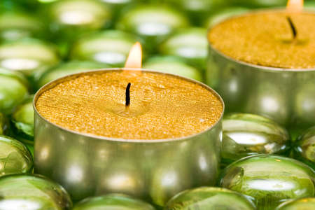 golden candles with green decoration balls の写真素材