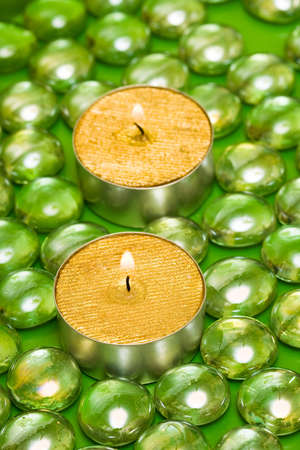 golden candles with green decoration balls の写真素材