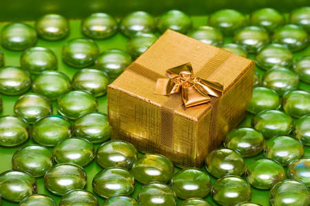 golden gift box with decoration balls の写真素材