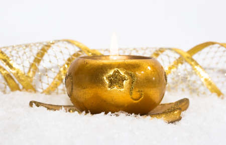 festive new-year candle with snow の写真素材
