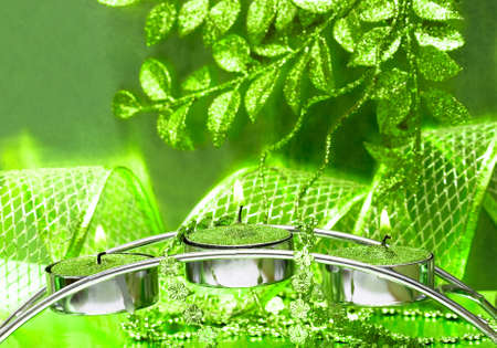 festive candles with green ribbon の写真素材