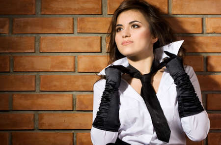 young sexy woman near the wall の写真素材