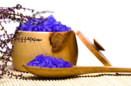 Spa essentials (bath salt in a spoon and flowers of lavender) の写真素材