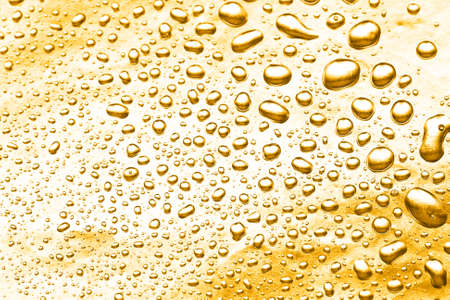 yellow water drops for background の写真素材