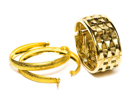 golden bracelet with ear-rings isolated on white background 