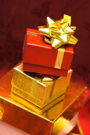 red and golden gift boxes with bow の写真素材
