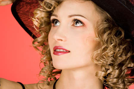 elegant woman is in a hat 