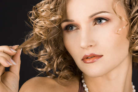 portrait of wonderful woman with curls の写真素材