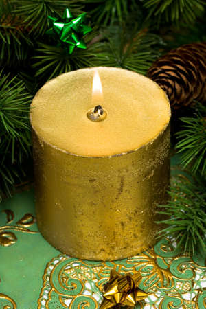 gold festive candles with fur-tree の写真素材