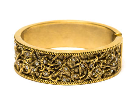 golden bracelet isolated on white background の写真素材