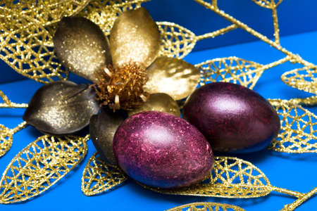Easter eggs with golden flower の写真素材