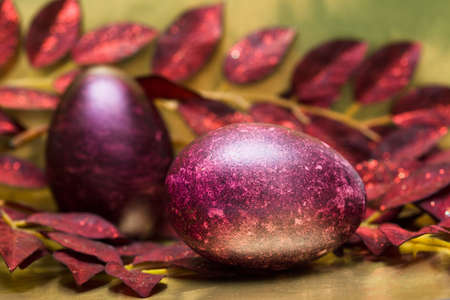 Easter egg with red leaves の写真素材