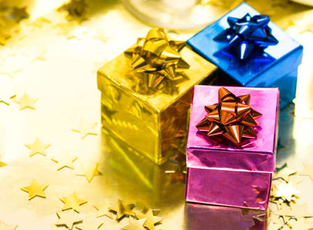 gift boxes with gold ribbon の写真素材