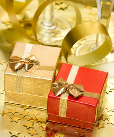 gift boxes with golden ribbon の写真素材