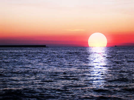 red beautiful sunset on sea  の写真素材