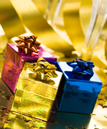 gift boxes with golden ribbon の写真素材