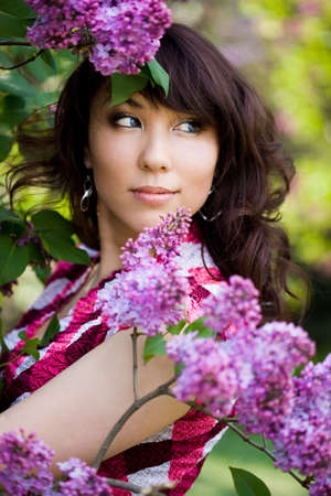 tender girl in the garden with lilacの写真素材