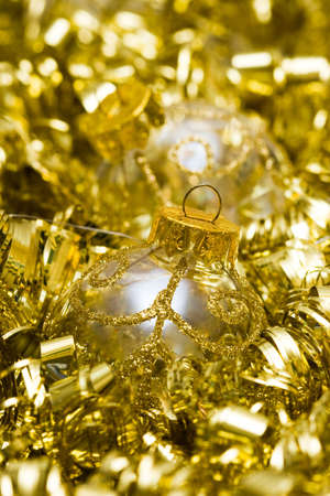 golden Christmas decoration ball with garlandの写真素材