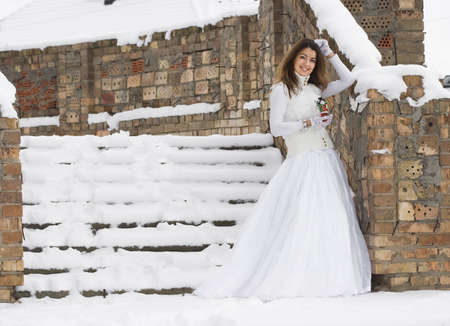 Bride in winter near the stairの写真素材