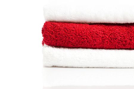 stack of red and white towels isolatedの写真素材