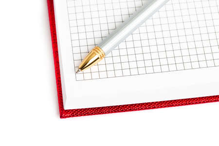 red notebook with silver penの写真素材