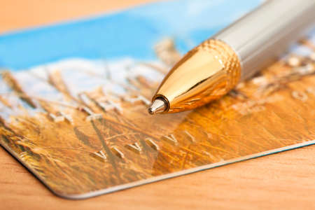 golden pen with credit cardの写真素材