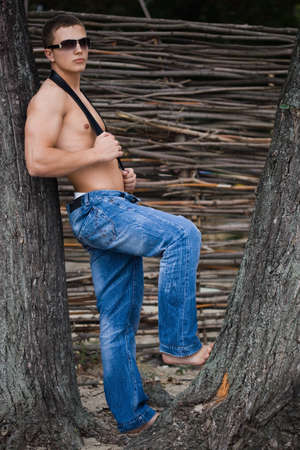 young bodybuilder man in streetの写真素材