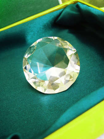 Beautiful diamond crystal on green box の写真素材