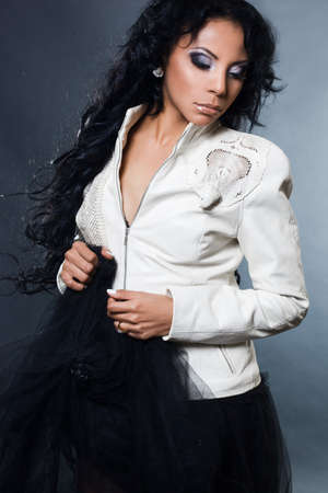 Sexy fashionable mulatto woman on black backgroundの写真素材