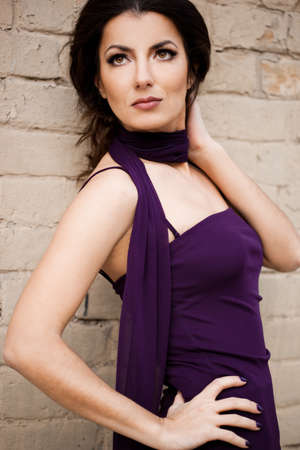 beautiful lady near the wallの写真素材