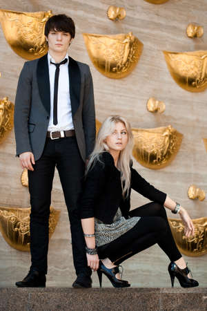 couple - girl and guy near the wallの写真素材