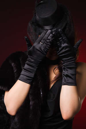 elegant fashionable woman in a hat