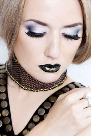 beautiful fashionable woman with art visageの写真素材