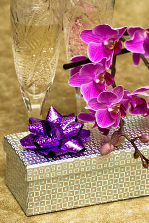 Gift box with purple orchid の写真素材