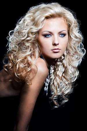 beautiful fashionable woman on black backgroundの写真素材